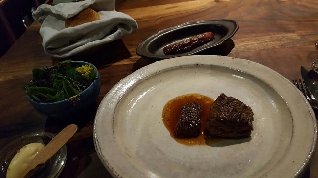 Antelope with stuffed radicchio, herb salad and biscuits with honey butter