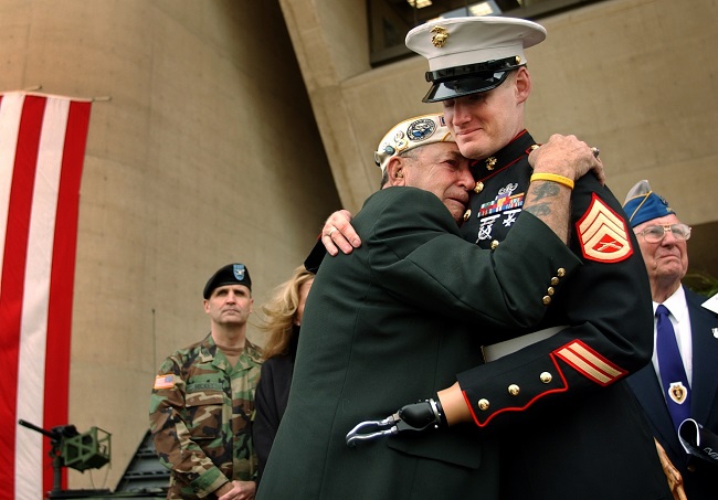 Pearl Harbor survivor embraces a fellow military man Pearl Harbor survivor embraces a fellow military man
