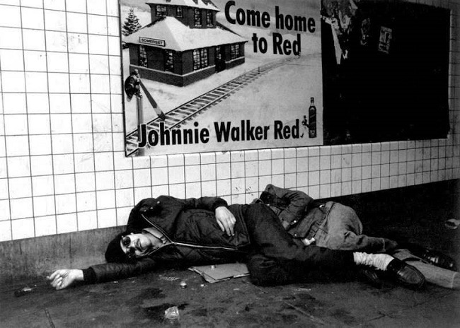 A man was seen the picture who was passed out drunk. These kind of scenes were quite regular on the subway trains A man was seen the picture who was passed out drunk. These kind of scenes were quite regular on the subway trains
