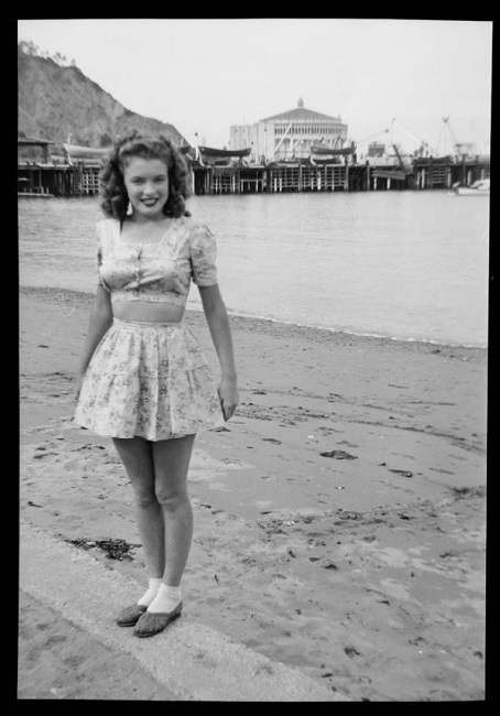 A very pretty Norma Jeane Mortenson is seen at her husband’s boot camp in the distance
