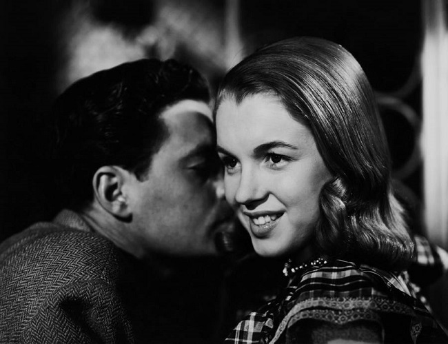 Norma Jeane Mortenson was seen very close to a model during the ad shoot for hair products