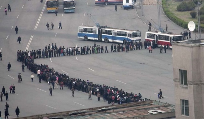 North Koreans are in the habit of getting into queue while doing many things. It is like a national sport there