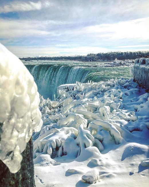 The surrounding of Niagara Falls has been frozen and it is looking amazingly beautiful with blue sky and blue water in the backdrop