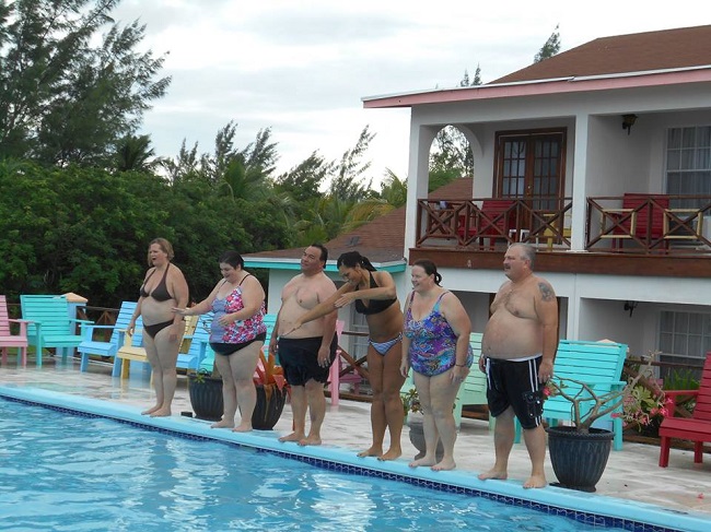 Overweight couple in the swimming pool Overweight couple in the swimming pool
