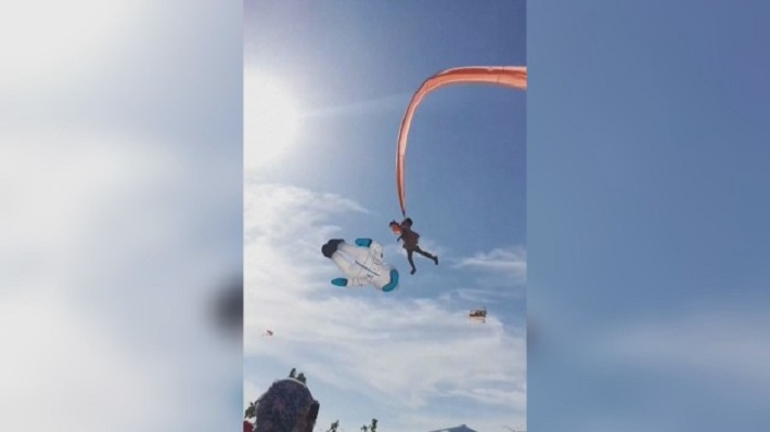 There were screams and cries from the area as the little girl was swung around by the kite