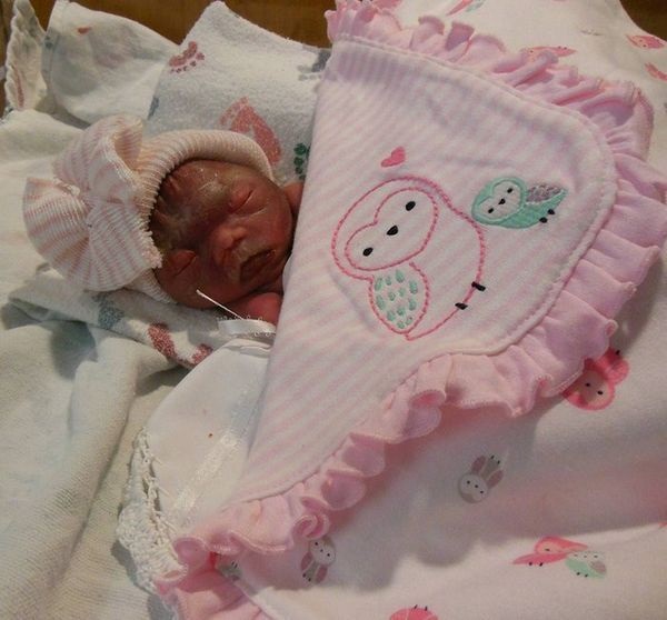 She tossed her baby out the second-floor window after strapping her into the car seat